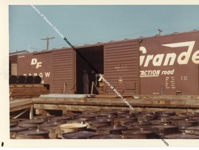 Rio Grande DF car being loaded with concentrate for shipment to Fernald, Ohio