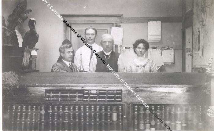 Four People At Registration Desk