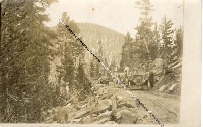 Early Automobiles Crossing Mountain Pass