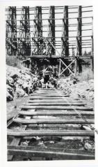 Photo and negative of culvert construction under Rock Creek trestle on the D&SLRR