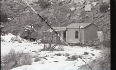 B&W photo of Winger Mine tunnel and structure in winter landscape.