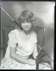 Negative of Young lady with ruffled dress