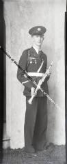 Negative of young man in band uniform
