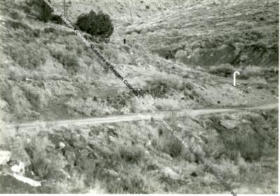 Photo of hillside with remnants of loading ramp