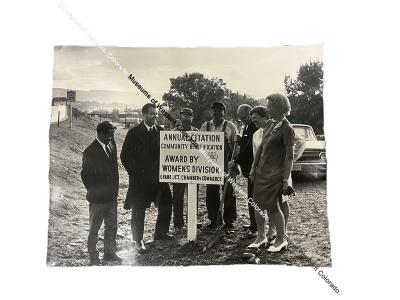 Photo of seven individual with Community Beautification sign