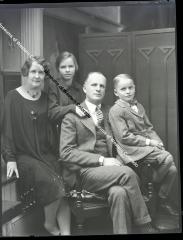 Negative of a family of four (Mom, Dad, Girl, Boy)