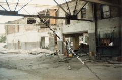 Color Photo of the demolition of Western Slope Auto