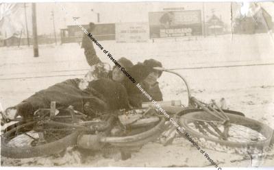 Ruth Maddux and Man Laying on Ground with a Fallen Motorbike 