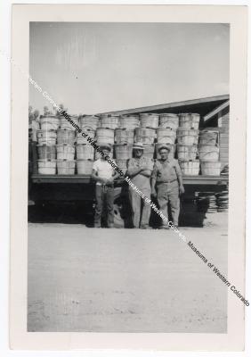 Black and White Photograph of 3 Men and a Truckload of Peaches