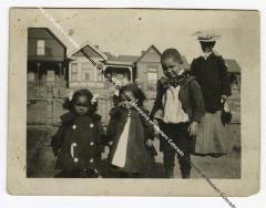 Photo of 3 children and a woman