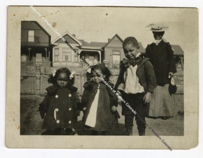 Photo of 3 children and a woman
