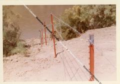Barbwire fence going down to river - AEC Compound