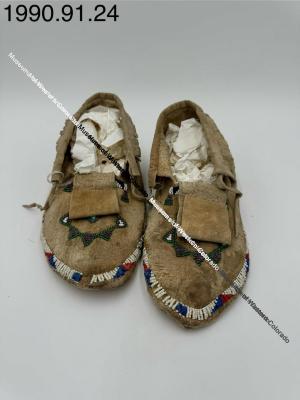 Beaded moccasins with fringe