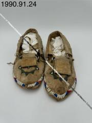 Beaded moccasins with fringe