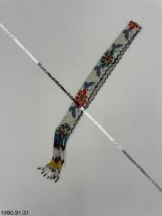 White beaded headband with multicolored flower and butterfly design