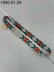 White beaded headband with 'x' and arrow design