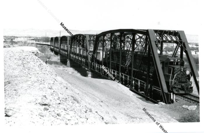 Mill Tailings train on Colorado river bridge 