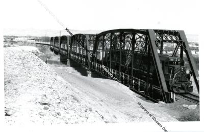 Mill Tailings train on Colorado river bridge 