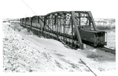 Mill Tailings train on Colorado river bridge 